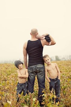 a man and two boys standing in a field with the words nothing makes a woman love a man more than seeing how much he loves their children