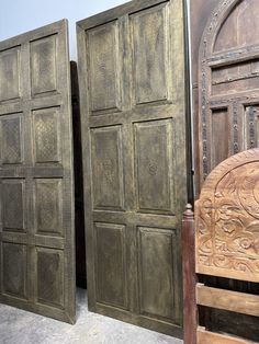 two wooden doors sitting next to each other