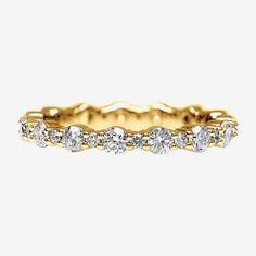 a yellow gold band with five diamonds