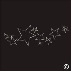 three stars are arranged in the shape of an arrow on a black background with white sparkles