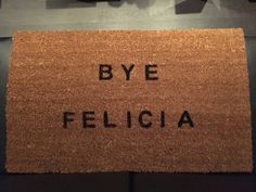 a door mat with the words bye felicia written in black ink on it