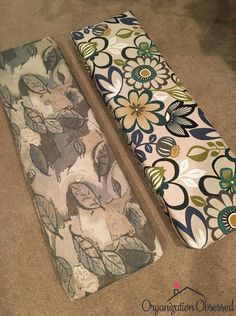 two pieces of fabric sitting on the floor next to each other with flowers and leaves