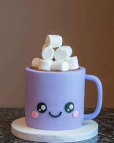 a purple cup with marshmallows in it