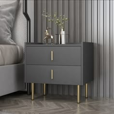 a nightstand with two drawers and gold handles