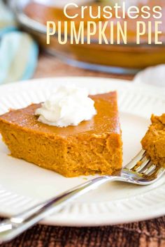 a slice of pumpkin pie on a white plate with a fork in front of it