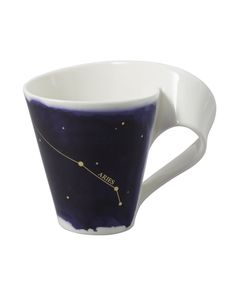 a coffee cup with the zodiac sign on it's side and stars in the sky