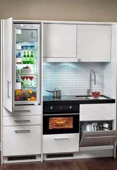 an open refrigerator in the corner of a kitchen