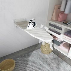 a white ironing board sitting on top of a rug