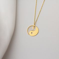 "Stylish and comfortable 14K gold Yin and Yang necklace with solid gold or sterling silver options for everyday wear. Great for stacking with other pendants to express yourself even better.  Wonderful and unique gift idea to show your love to important people in your life with a cute and dainty gift. This Yin Yang necklace makes a perfect gift for anyone who's in touch with their spirituality or to yoga lovers who's trying to keep things balanced in their lives.  ♥ All our jewelry is custom made Gifts For Yogi Jewelry, Necklace Yin Yang, Everyday Symbolic Gold Necklace, Hypoallergenic Yellow Gold Necklace With Round Pendant, Minimalist Cadmium-free Round Necklace, Gold Round Necklace For Meditation, Yin And Yang Necklace, Yin Yang Charm, Yin Yang Necklace