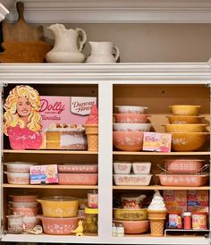 a cabinet filled with lots of different types of bowls and containers on top of it