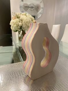 a decorative vase sitting on top of a table