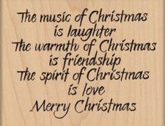 a wooden plaque with the words merry christmas written in black ink on top of it