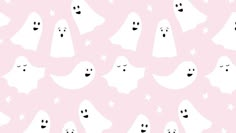 a pink background with ghost faces and stars