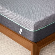 a close up view of a mattress on a bed frame