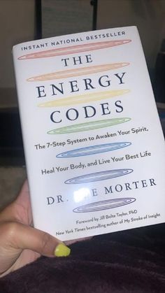 the energy code book being held up by someone