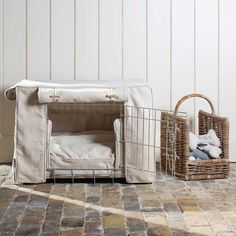 a dog bed and basket on the floor