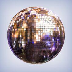 a shiny disco ball in the air against a blue sky background stock photo 549782