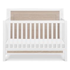 a white crib with wooden slats on the bottom and side rails, in front of a white background