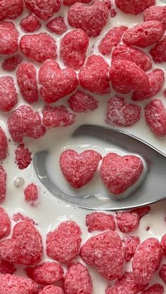 a spoon with some heart shaped sugar on it