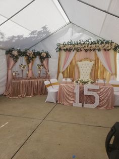 a tent with tables and chairs set up for an event