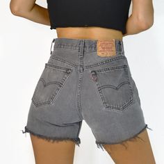 This vintage denim was produced over 20 years ago, giving it quality and character that can't be rivaled. No two pairs of jeans at DETOUR VINTAGE are the same--owning a pair is owning a piece of history. This pre-loved garment may show signs of age, but all of our denim is clean and ready to wear. MEASUREMENTS Waist: 30" | High hip: 34.5" | Low hip: 41.5" | Thigh: 22.5" | Rise: 11.75" | Inseam: 3.75" LEVI'S 501 | 100% COTTON | 1990s HIGH RISE | BUTTON FLY | RED TAB | RAW HEM MADE IN USA | TAG SI Washed Black Vintage Bottoms For Spring, Vintage Faded Short Length Bottoms, Vintage Washed Black High-rise Bottoms, Vintage High Rise Washed Black Bottoms, Vintage Distressed Short Length Bottoms, Vintage Distressed Short Bottoms, Casual Reworked Faded Bottoms, Faded Vintage Jean Shorts, Vintage Jean Shorts For Streetwear