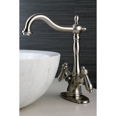 a faucet that is sitting next to a bowl