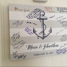 a sign with an anchor and names on it