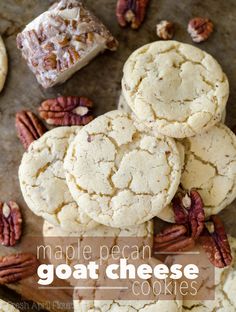 a pile of pecan cookies sitting on top of a table next to some pecans