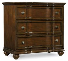 a brown wooden dresser with four drawers