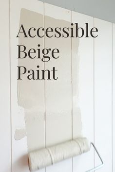 a white painted wall with the words, accessible beige paint written in black on it