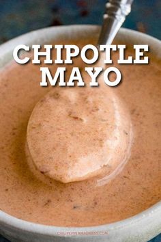 chipotle mayo in a white bowl with a spoon on top and the words chipotle mayo above it