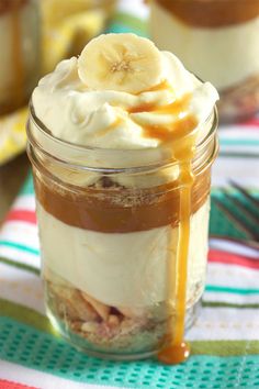 there is a banana pudding in a jar with ice cream and caramel syrup on top