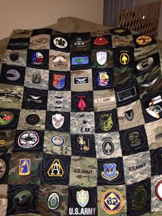 an army quilt with many patches on it