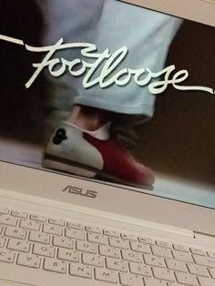 an asus laptop with footloose on the screen