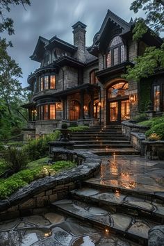 a large stone house with steps leading up to it