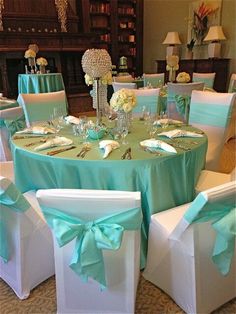 the tables are set with green and white linens