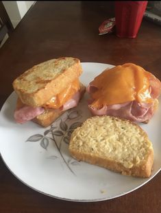 a plate with ham and cheese sandwiches on it