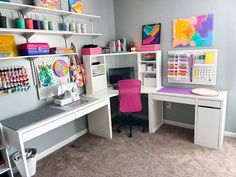 a room with two desks and shelves filled with crafting supplies on top of carpeted floors