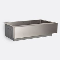 a stainless steel kitchen sink on a white wall