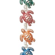 four sea turtle wind chimes hanging on a white background