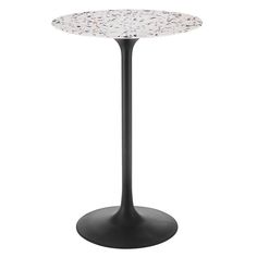 a black table with white dots on the top and a round base, in front of a