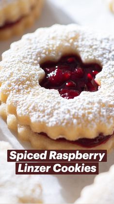 powdered sugar cookies with jelly filling on top