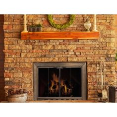 a stone fireplace with a fire burning in it