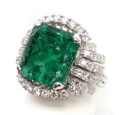 TOTAL RING WEIGHS 13.2 GRAMS 18K & 11. ct NATURAL COLOMBIAN EMERALD (EXCELLENT COLOR WITH NATURAL INCLUSION'S) & (42) 2pt SINGLE CUT GEMS WHITE DIAMONDS AND (12) 6pt BRILLIANT CUT ROUND GEM WHITE CLEAN DIAMONDS  /  SIZE 7 1/2  Contact our office for any questions you may have  We are available Monday - Friday 10am-5pm EST All emails sent over the weekend will be answered on Monday We deal with preowned, vintage, estate items and collectables. The word excellent is used only to describe the condi Golden Rings, Golden Ring, Wedding Accessories Jewelry, Chic Leather, Colombian Emeralds, Emerald Cut Diamonds, Natural Emerald, Diamond Sizes, White Diamonds