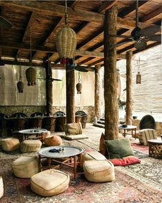 an outdoor living area with lots of furniture