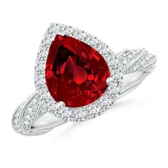 a pear shaped ruby and diamond ring in 18k white gold with diamonds around the band