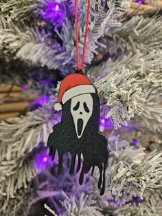 a christmas ornament hanging from a tree