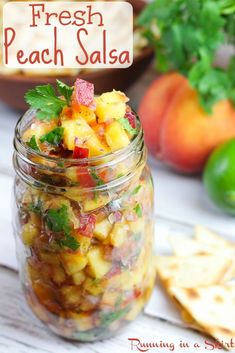 fresh peach salsa in a mason jar with tortilla chips