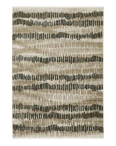 an area rug with black and white stripes on the bottom, in neutrals and browns