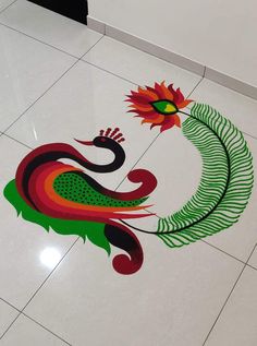 the floor is decorated with colorful designs on it, and there are two peacocks in the center